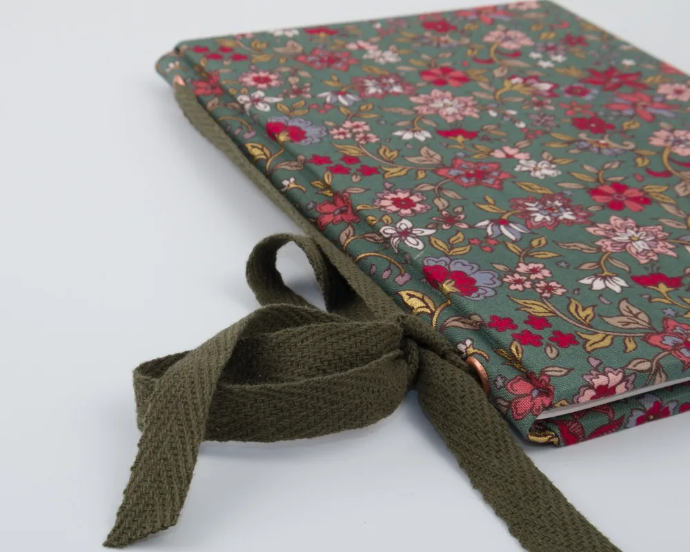 Fabric bag with floral print and tie closure