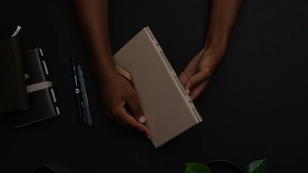 Hands holding a finished handmade book